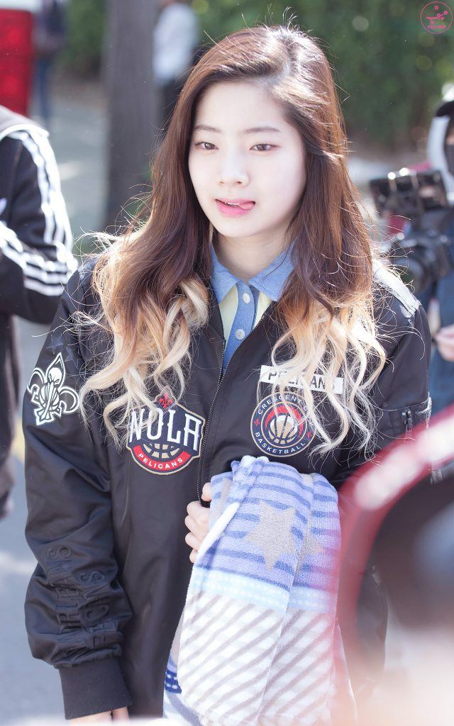 Image: TWICE's Dahyun rocking a black bomber jacket with edgy patches on the way to a music broadcast