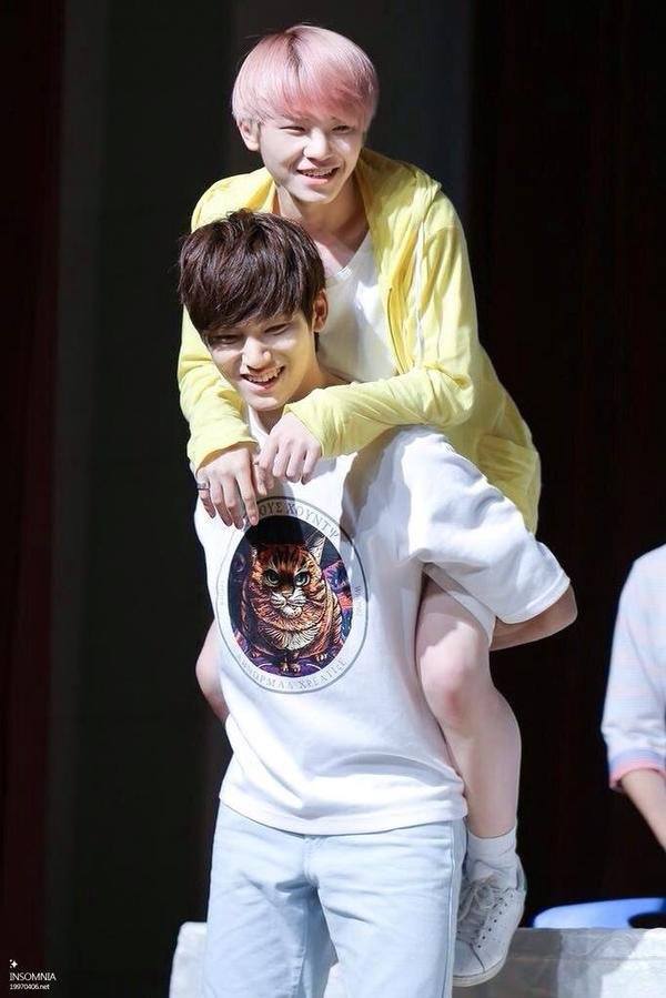 SEVENTEEN's Woozi getting a piggyback ride from Mingyu / Pledis Entertainment